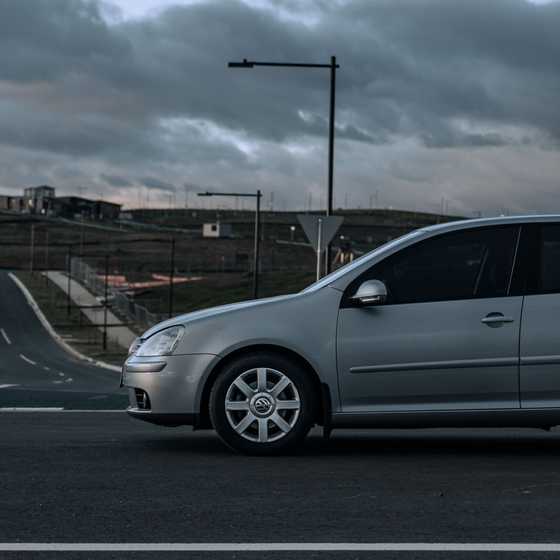 Far away front wheel view of a VW Golf